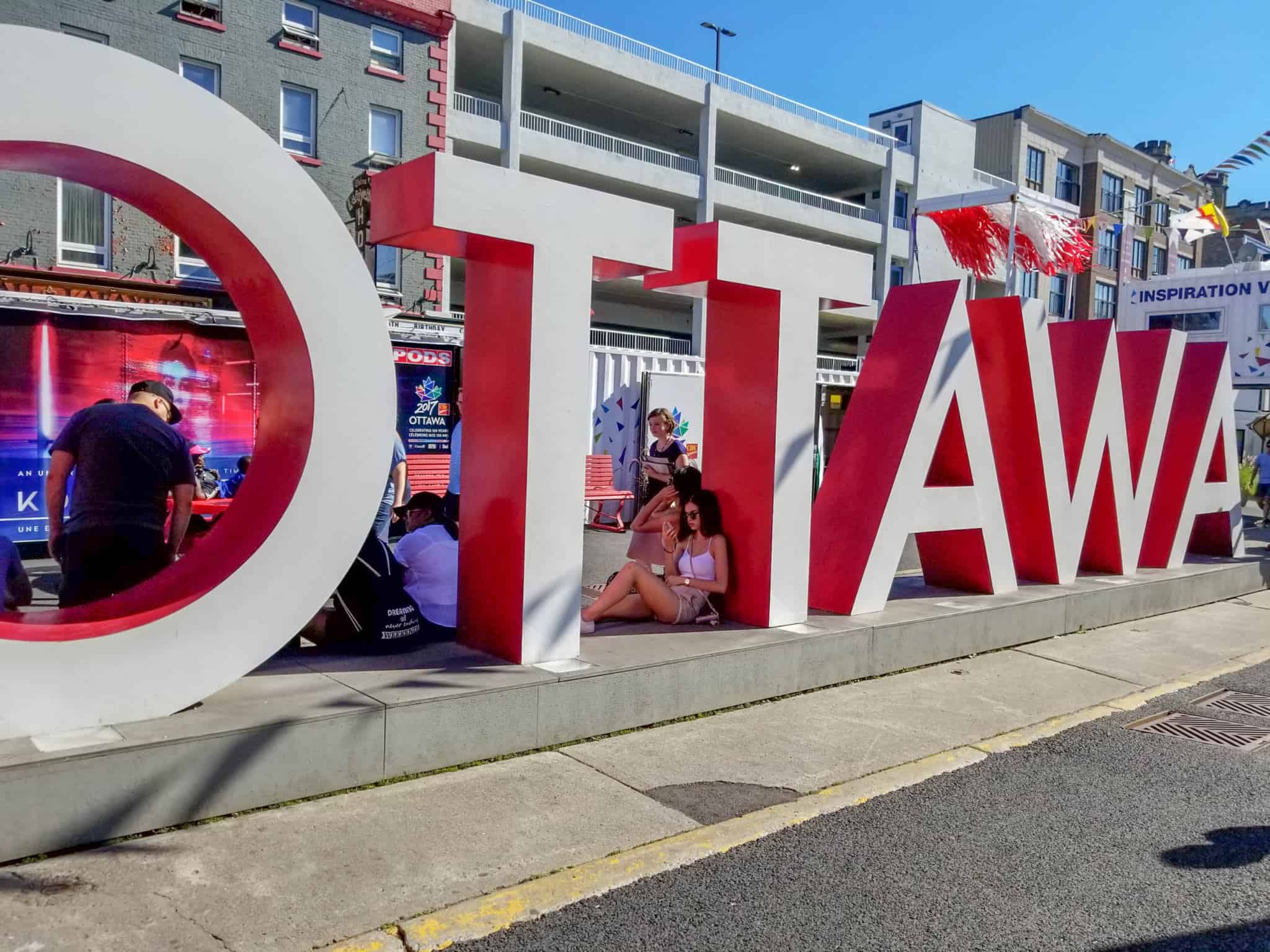 Taking a selfie with the Ottawa Sign is one of the things to do in Ottawa