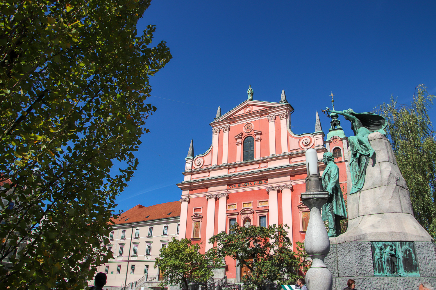 Visiting the pink Franciscan Church of the Annunciation is one of the things to do in Ljubljana