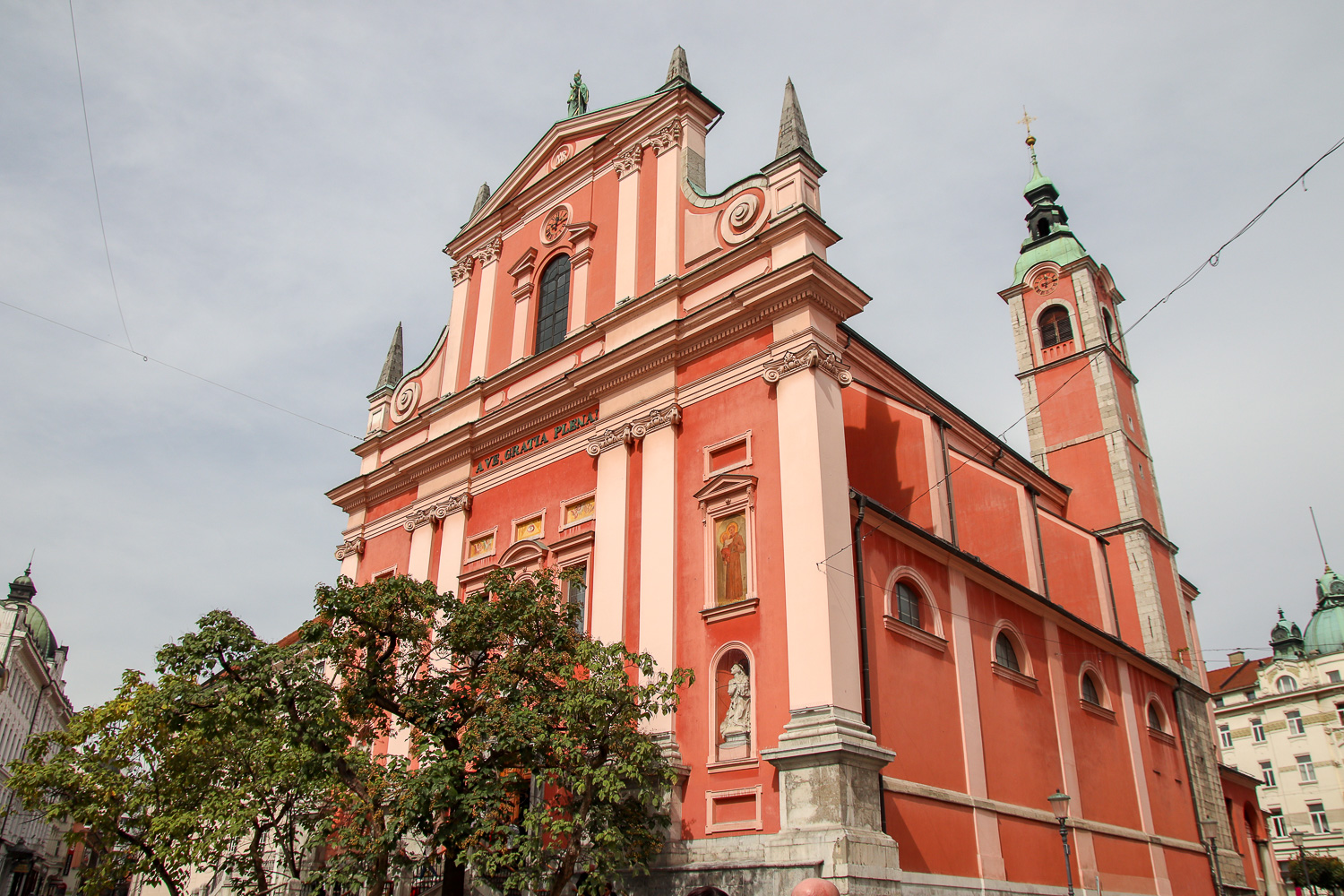 Visiting the pink Franciscan Church of the Annunciation is one of the things to do in Ljubljana